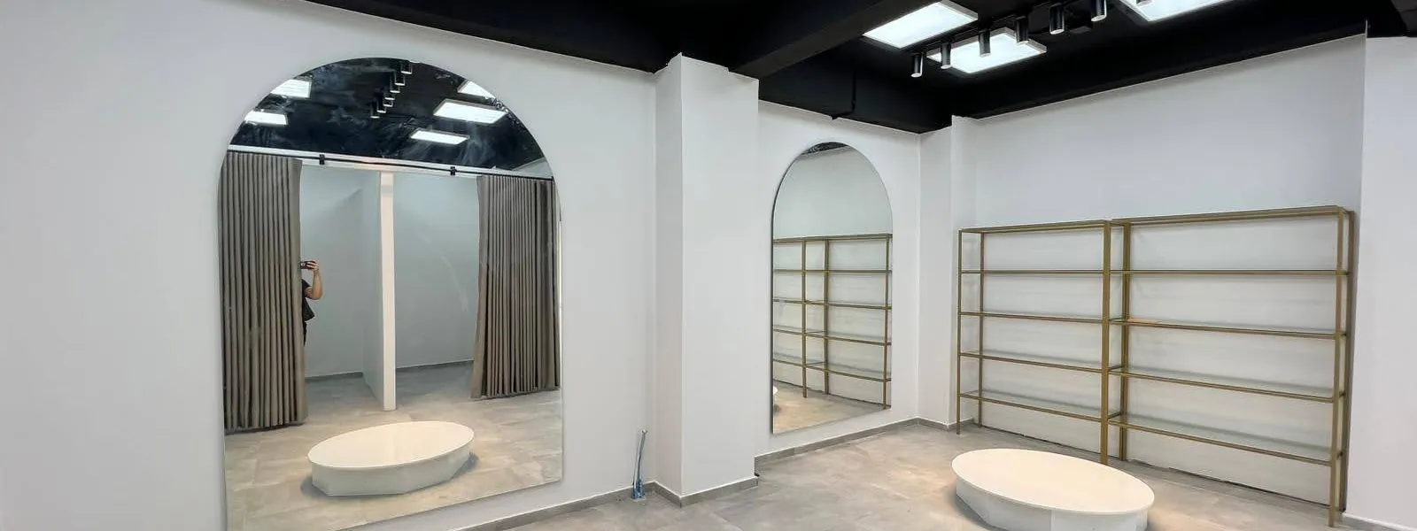 Interior with arched mirrors and bespoke shelving